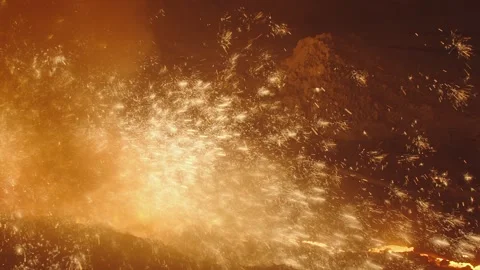 Casting of molten cast iron with the release of sparks and drops of metal Stock Footage 147194055