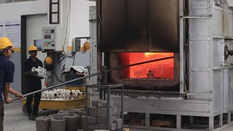 The casting part is put into the furnace for heating. Stock Footage 252116490