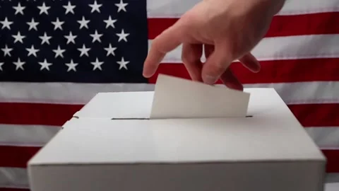 Casting a vote into us election ballot box Stock Footage 335520573