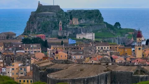 Castle and town view featuring old architecture and waving greek flag Stock Footage 341332797