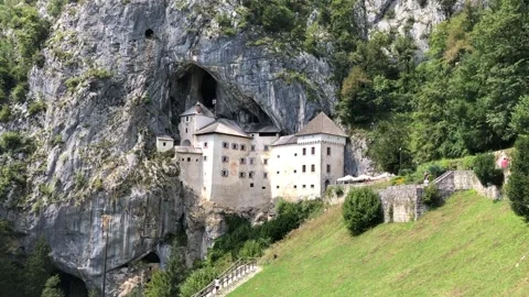 Castle built in a Cave with falling leaves Stock Footage 141671294