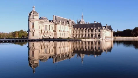 Castle of chantilly at sunset with reflection on pond, oise picardy france Stock Footage 112863315