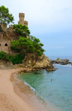 Castle on cliff by beach, Lloret de Mar, Costa Brava, Spain Stock Photos