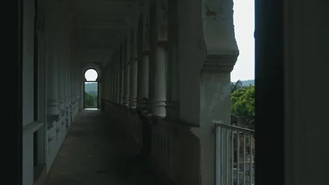 Castle corridor with white pillars and arched doorways Video stock 335668197