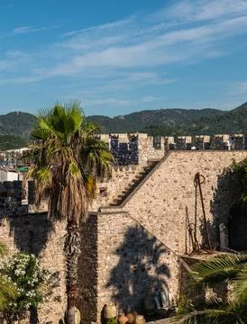 Castle courtyard with garden and ancient walls in Marmaris Turkey Stock Photos