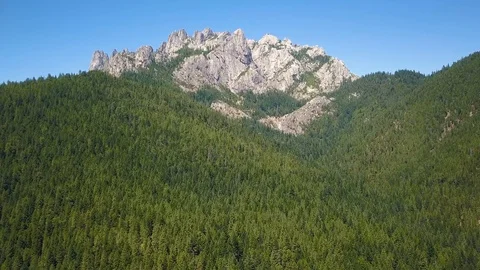 Castle Crags rock formation in Northern California distant approach (Aerial) Stock Footage