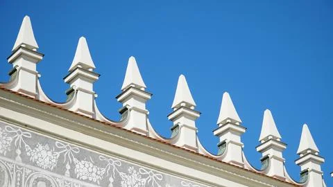 Castle decoration elements. Gothic arches against the background of the sky.  Stock Photos