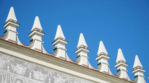 Castle decoration elements. Gothic arches against the background of the sky.  Stock Photos