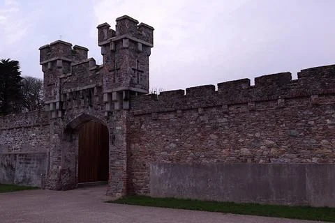 Castle gate with stone wall. Stock Photos