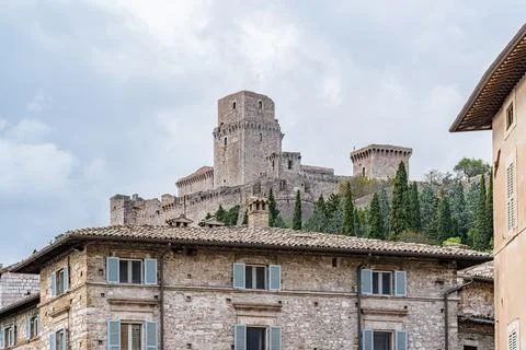 A castle with a large tower and a small tower in Assisi city in Italy Umbria Stock Photos