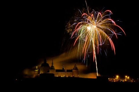 Castle lighted by fireworks Stock Photos