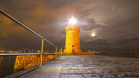 Castle Lighthouse Illuminated With Moon Over Cloudy Evening Sky At Saint Vídeo Stock 167403074
