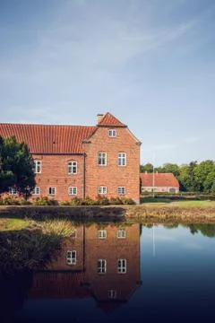 Castle made of red bricks with reflection Stock Photos