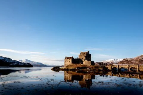 Castle with a mountainous backdrop Stock Photos
