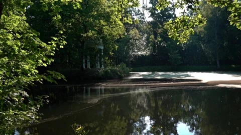 Castle park Leipzig Luetzschena in summer with a lake and trees and a pavilion Stock Footage 201528260