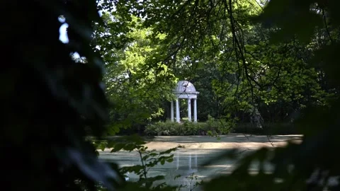 Castle park Leipzig Luetzschena in summer with a lake and trees and a pavilion. Stock Footage 201528276