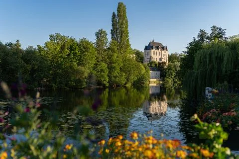 Castle Raoul with Yellow Flower and Reflection in Water in Chateauroux Stock Photos