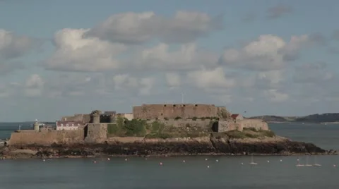 Castle in the sea with clouds overhead Stock Footage 12210242