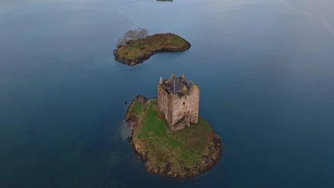 Castle stalker orbiting aerial view at sunrise Stock-Footage 334060803