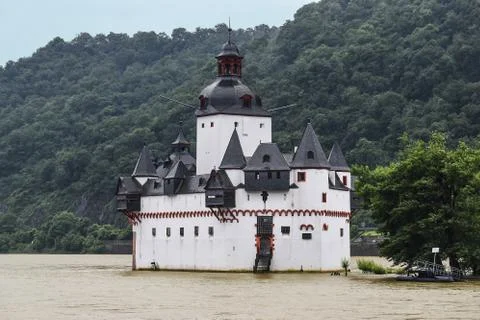 Castle stands on the river Stock Photos