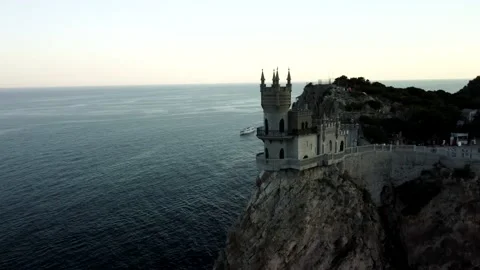 Castle on top of a cliff at sunset Stock Footage 160467102