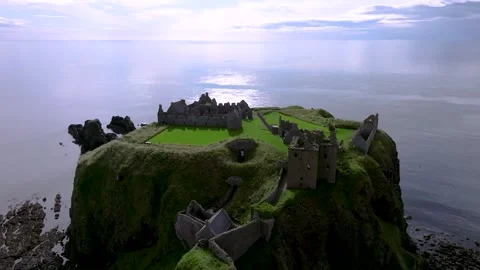 A castle is on top of a hill overlooking the ocean Stock Footage 306624703