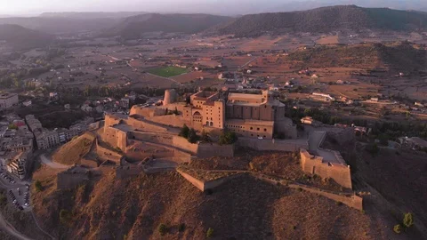 A castle on top of a mountain at sunset. It is the Cardona Castle in Catalonia. Stock Footage 119694328