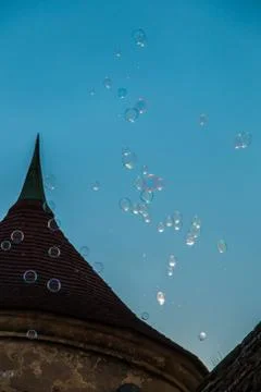 Castle tower and soap bubbles in the sky Stock Photos