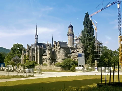 Castle under restauration, bicycles passing through, historical building Stock Footage 80532478