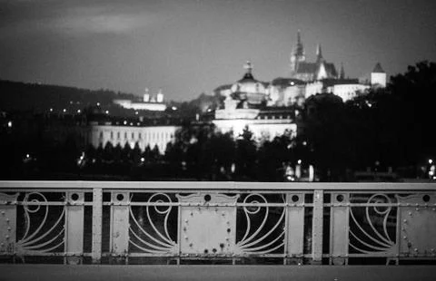 Castle view from the bridge, focus on the rail. Stock Photos