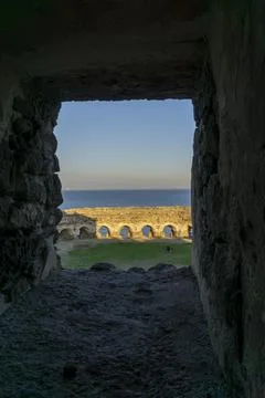 Castle view through stone window Stock Photos