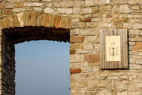 Castle wall with a clock Stock Photos