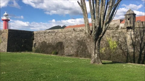 Castle wall with a naval lighthouse inside Stock Footage 303749644
