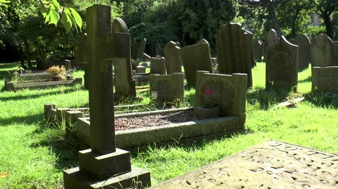 Castleton cemetery, Peak District (hard light, left-right pan). Video stock 53399329