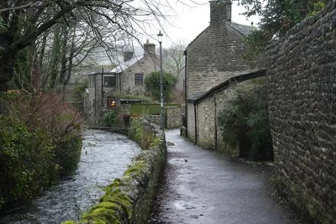 Castleton, The Peak District: Stream, Stone Walls, Houses On A Gloomy Day. Stock Photos