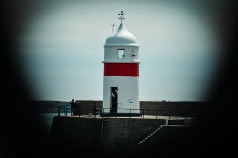 Castletown Lighthouse Captured Through Bridge Railings 스톡 사진