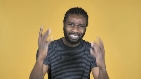 Casual African Man Gesturing Failure and Problems Isolated on Yellow Background Stock Footage 99134980