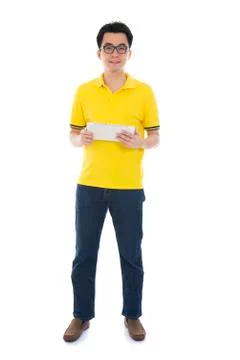 Casual asian man with a tablet computer Stock Photos