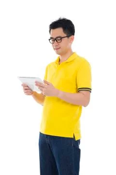 Casual asian man with a tablet computer 스톡 사진