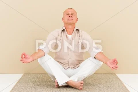 Casual business yoga senior man relax meditate Stock Photos
