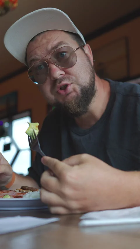 Casual Dining Experience A Man Enjoying His Meal While Eating in a Cozy Stock Footage 313558594