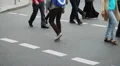 Casual dressed people walk on crossroad pedestrians city daytime HD Footage