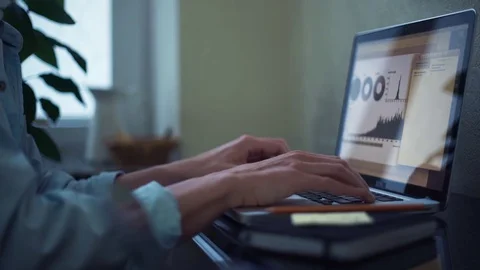 Casual dressed young man drinking coffee using laptop at home Stock Footage 82931431