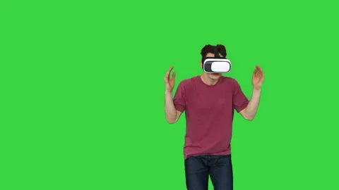 Casual gamer dancing locking hip-hop in VR headset playing dancing game on a Stock Footage 140373634