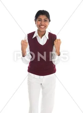 Casual indian female in sweater celebrating success Stock Photos