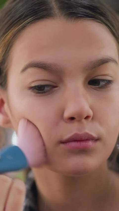 Casual makeup practice capturing expressive facial details naturally, Juvenile Stock Footage 329467040
