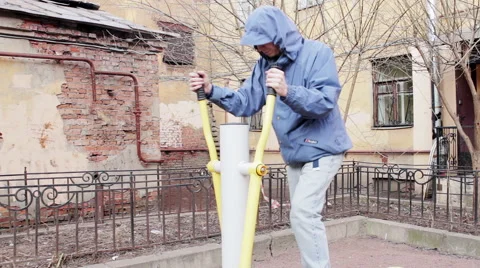 Casual Man Doing Exercises On training apparatus Outdoor 스톡 동영상 63719597