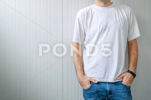 Casual Man In Jeans Trousers And White T-Shirt