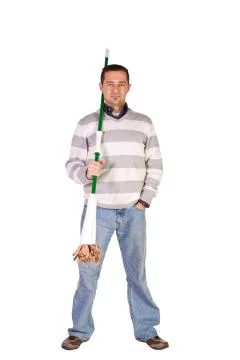 Casual man posing with a sweeper Stock Photos