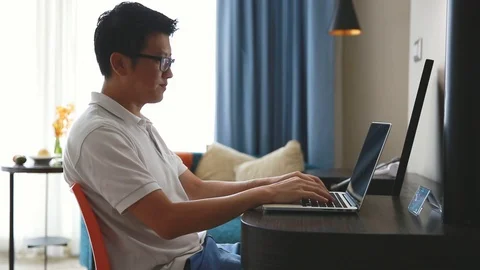 Casual man relaxing using computer notebook Stock Footage 91089432